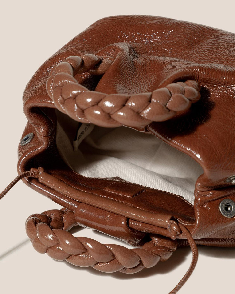 Hereu Crossbody Bags | BOMBON CRINKLED GLOSSY - Small Plaited-handle Leather Crossbody Bag - Women